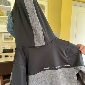 Under Armour Jacket.  Black and Grey with hood.  Like new, too big for me.  Warm